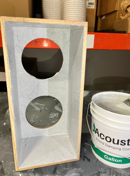 This absorption keeps the sound clear by preventing the muddiness that happens when sound waves randomly bounce around inside a speaker. This image is the inside of the speaker cabinet with Acuost-X